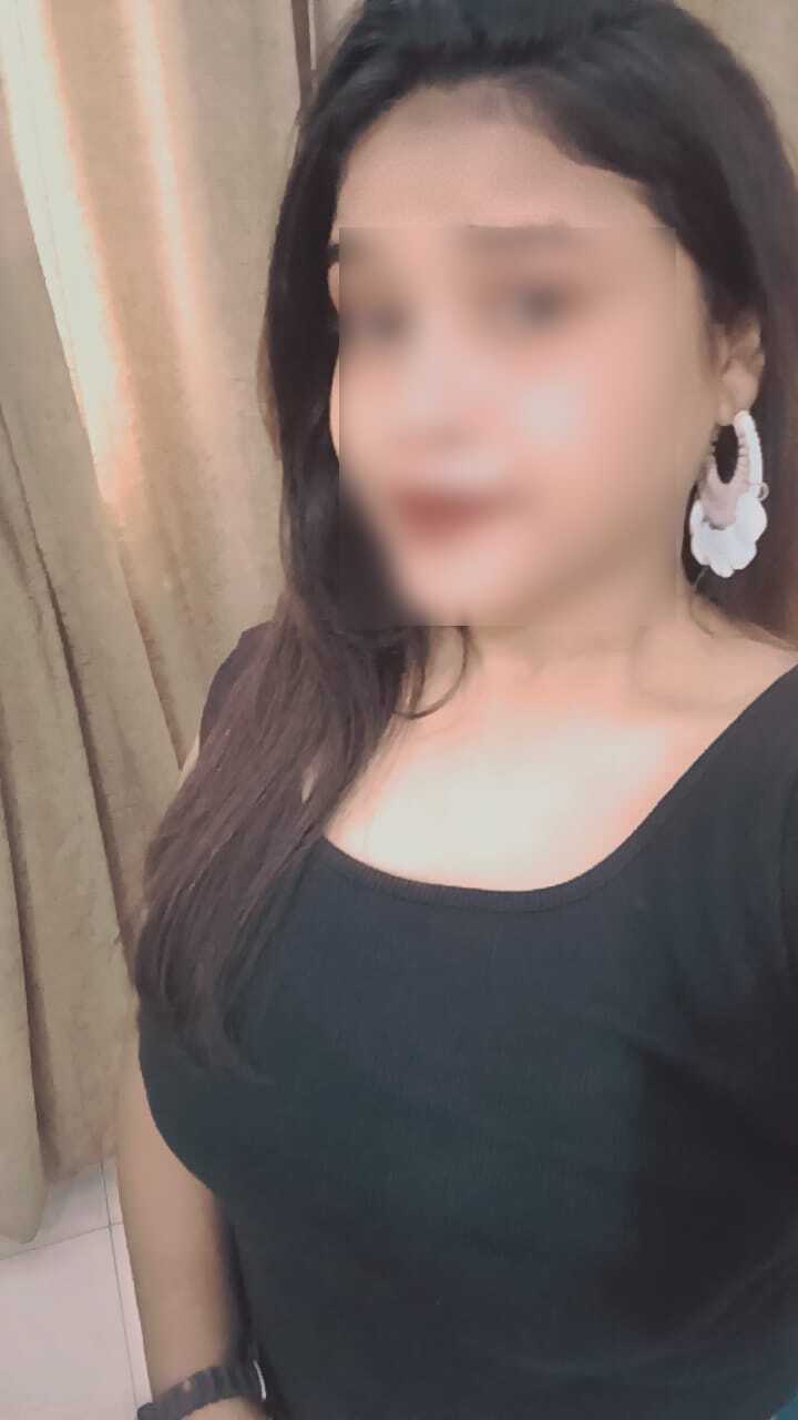 Beautiful Dehradun escort model smiling in elegant dress